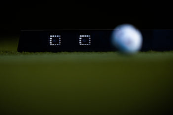 NOVA launch monitor close-up of dual sensor cameras capturing golf ball in flight